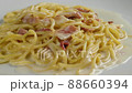 carbonara spaghetti with cream on a white plate, rotation shot 88660394