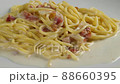 carbonara spaghetti with cream on a white plate, rotation shot 88660395