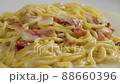 carbonara spaghetti with cream on a white plate, rotation shot 88660396