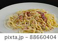 carbonara spaghetti with cream on a white plate, rotation shot 88660404