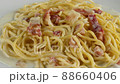 carbonara spaghetti with cream on a white plate, rotation shot 88660406