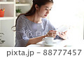 Young woman reading in the room 88777457