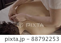 Professional female masseur doing massage for client at spa salon, healthcare 88792253