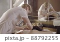Professional female masseur doing massage for client at spa salon, healthcare 88792255