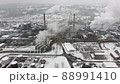 Factory chimneys blowing pollution in environment. Aerial drone view of industry complex. Industrial air pollution from smokestacks. Toxic smoke from chimney in industrial area during winter. 88991410