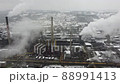 Factory chimneys blowing pollution in environment. Aerial drone view of industry complex. Industrial air pollution from smokestacks. Toxic smoke from chimney in industrial area during winter. 88991413