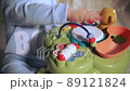 baby's hand knocks on toy in which drum is built 89121824