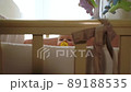 baby has just woken up and is sitting in crib 89188535