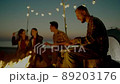 Group of young people having camp on the beach at night 89203176