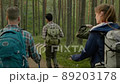 Group of people hiking in a forest 89203178