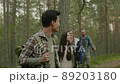 Group of people hiking in a forest 89203180