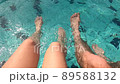 couple moving their feet underwater  89588132