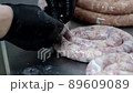 Process of sausage production at meat processing plant. 89609089