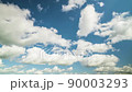 Cloudscape timelapse. Blue sky with white fluffy clouds. Time lapse video 90003293