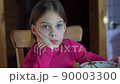 Beautiful girl sitting on chair ang thinking, 4k real time video footage 90003300