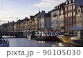 Copenhagen, Denmark, Timelapse - People walking at the Nyhavn Waterfront canal before the sunset 90105030
