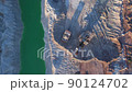 Excavator load limestone in mining truck in open pit mine. Haul truck transports chalk and clay  90124702