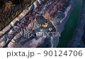 Excavator load limestone in mining truck in open pit mine. Haul truck transports chalk and clay  90124706