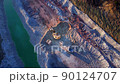 Excavator load limestone in mining truck in open pit mine. Haul truck transports chalk and clay  90124707