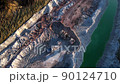Excavator load limestone in mining truck in open pit mine. Haul truck transports chalk and clay  90124710