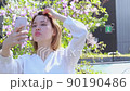 Woman taking a selfie 90190486