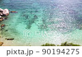 4K Aerial drone top down view bird eye view of sea waves, rock and sand. Beautiful of sea water wave come to beach. Phuket Thailand tropical beach. 90194275