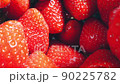 extreme close-up of a bunch of ripe strawberries, detailed 90225782