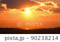 Airplane taking off from Kumamoto Airport toward the setting sun 90238214