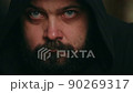 A man with a beard shakes head, denial then agrees, static camera, close-up of the face 90269317