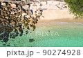4K Aerial drone top down view bird eye view of sea waves, rock and sand. Beautiful of sea water wave come to beach. Phuket Thailand tropical beach. 90274928