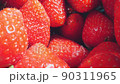 extreme close-up of a bunch of ripe strawberries, detailed 90311965