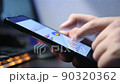 Businessman Using Phone With Financial Data 90320362
