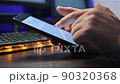 Businessman Using Phone With Financial Data 90320368