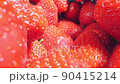 extreme close-up of a bunch of ripe strawberries, detailed 90415214