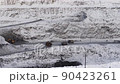 Open pit mine coal mining, dumpers, quarrying extractive industry stripping work. Big Mining Trucks. View from drone at opencast mining with lots of machinery trucks 90423261