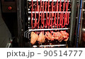 The meat and raw sausages loaded into modern smokehouse 90514777