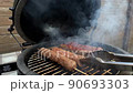 Fry kebab on the grill, the meat on the grate goes smoke 90693303