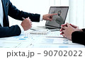 Business meeting, Businessman is summarizing financial graphs and analyzing market trends from a laptop to develop a company's revenue, Brainstorming or Discussing concept. 90702022