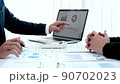 Business meeting, Businessman is summarizing financial graphs and analyzing market trends from a laptop to develop a company's revenue, Brainstorming or Discussing concept. 90702023