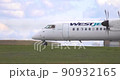 Calgary, Alberta, Canada. May 16, 2022. A De Havilland Dash 8-400 westjet plane getting ready to take off. Concept: Domestic Air Traveling 90932165