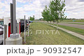 Calgary, Alberta, Canada. Jun 4, 2022. A panning to a Tesla Destination Charger at a parking lot with charging cars. 90932547