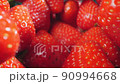 extreme close-up of a bunch of ripe strawberries, detailed 90994668