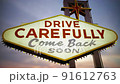 evening clouds over the DRIVE CAREFULLY sign Las vegas	 91612763