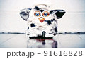 old  Furby  toy on a wooden floor loop 91616828