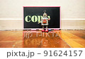 little robot writes CODING on a blackboard	 91624157