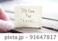 It's travel time. Paper card with an inscription. Summer Vacations idea. 91647817