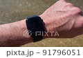 Smart watch on a man's hand, swimming with a watch on the sea 91796051