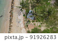 Tent and car on sea shore. Asia couple with beach accessories and car near beach under coconut tree, aerial view. Summer trip. Camping tent having relax time and enjoying adventure travel lifestyle 91926283