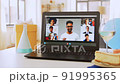 laptop with people having virtual birthday party 91995365