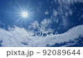 The sun, the summer sky and the flowing white clouds 92089644